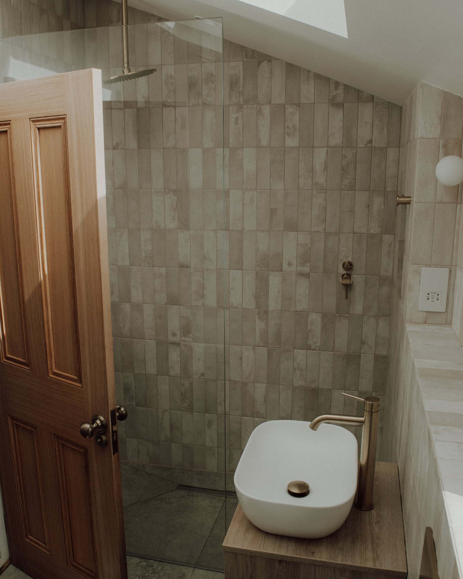 The Cheltenham bathroom, with the vanity, basin and tiled shower area